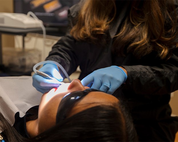 Dr. Castillo using a Fotona LightWalker dental laser