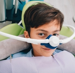 Young child receiving nitrous oxide dental sedation