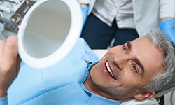 The placement of your prosthetic teeth is the final step in the four step dental implant process