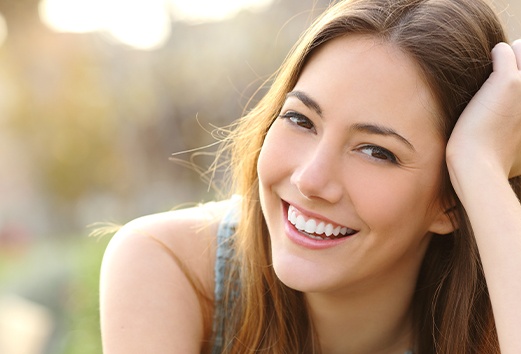 Woman with healthy smile after visiting her dentist