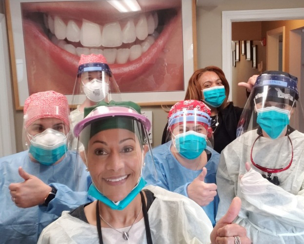 Dental team wering protective face masks