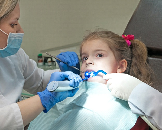 Child receiving dental sealants in North Providence