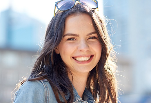 Young woman smiling after wisdom tooth extraction