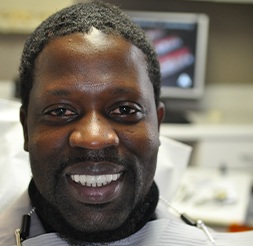 Man smiling after tooth replacement