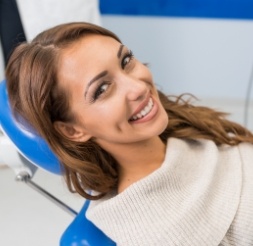 Woman smiling during sedation dentistry visit