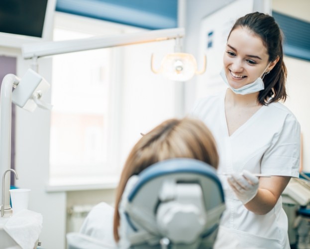 Patient receiving dental checkup and teeth cleaning