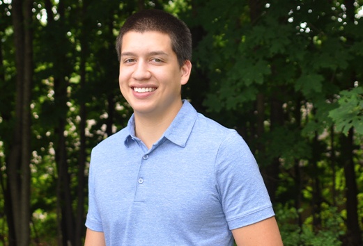 Man with perfectly aligned smile after orthodontics treatment