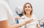 Woman in dental chair smiling