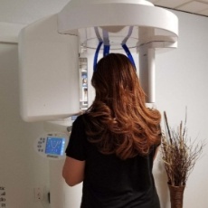 Dental patient receiving 3 D digital x-ray scans