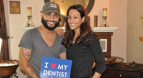 Doctor Castillo and patient smiling together