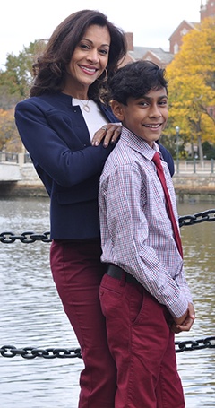 Doctor Castillo and her son on a dock overlooking water