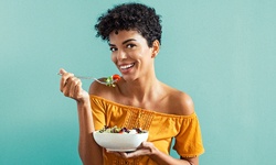 Woman eating salad in North Providence