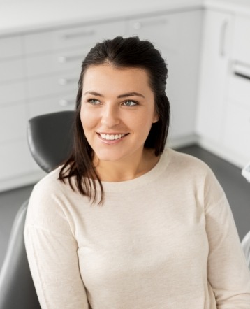 Woman smiling during biological and holistic dentistry visit