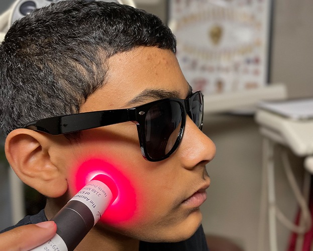 Woman receiving 3 D cone beam imaging scans