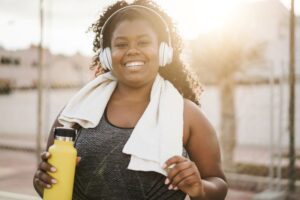 Happy woman enjoying exercise outdoors